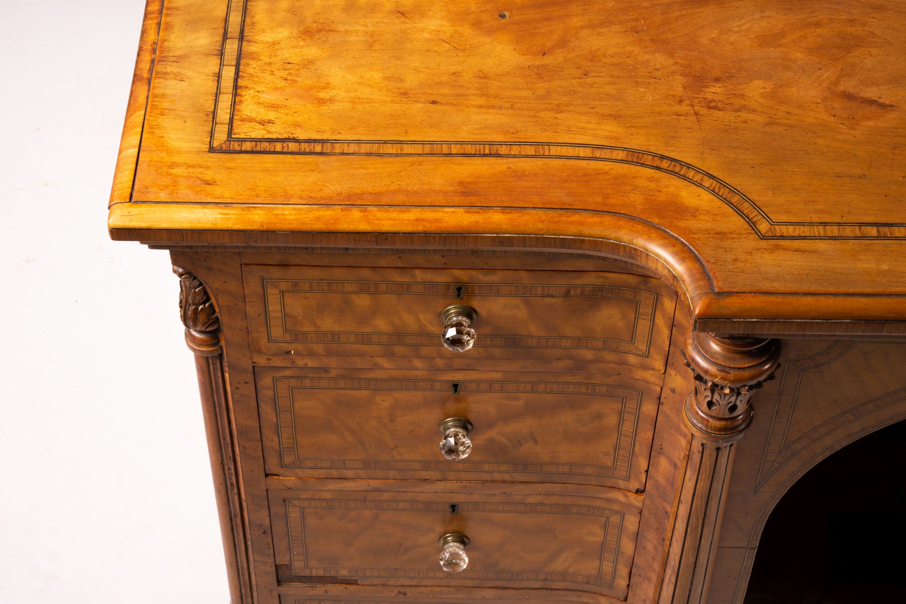 A late Victorian banded satinwood kneehole desk, width 138cm, depth 67cm, height 71cm